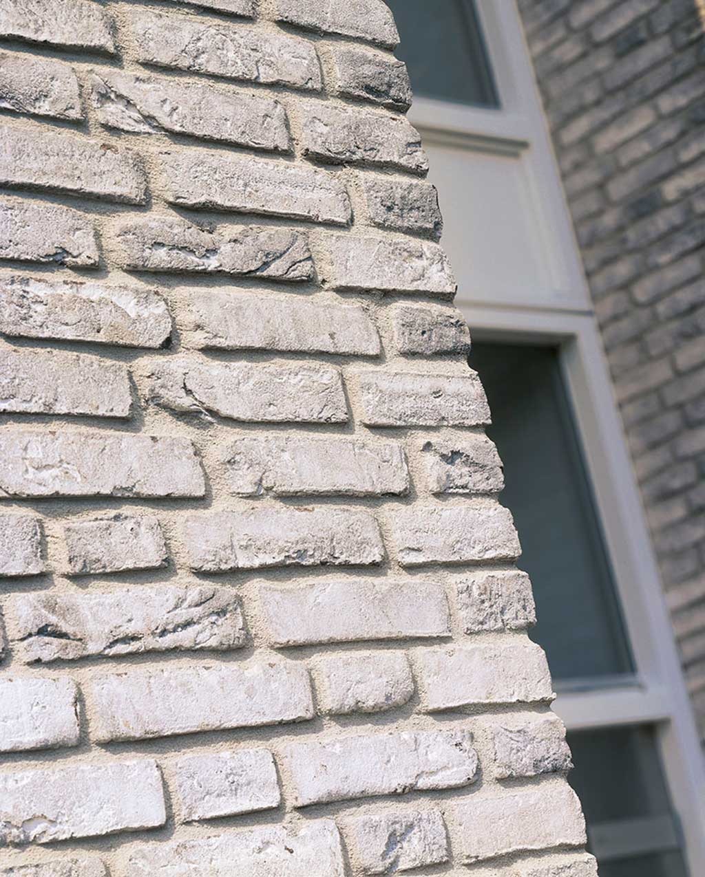 A white brick residential building